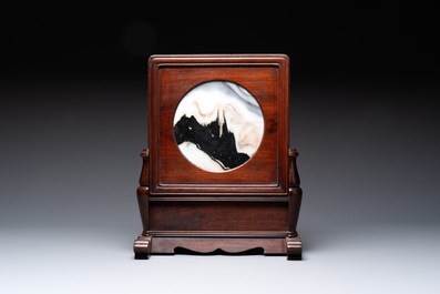 A varied collection of three Chinese brush pots, two sculptures, a lacquered covered box and a marble-inlaid wooden table screen, 20th C.