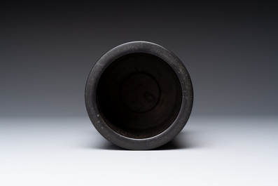 A varied collection of three Chinese brush pots, two sculptures, a lacquered covered box and a marble-inlaid wooden table screen, 20th C.