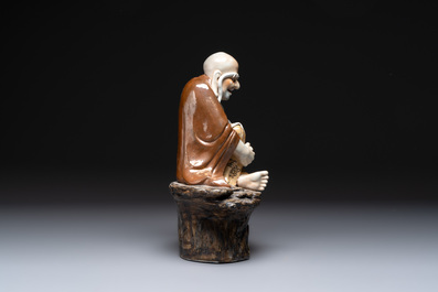A Chinese brown- and caf&eacute;-au-lait-glazed Luohan, Zeng Longsheng 曾龍升 mark, 20th C.