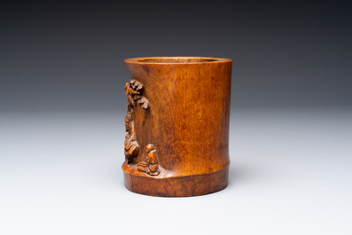 A varied collection of three Chinese brush pots, two sculptures, a lacquered covered box and a marble-inlaid wooden table screen, 20th C.
