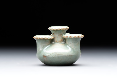 A small and rare Chinese Longquan celadon quadruple-neck vase, Song/Yuan