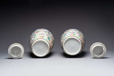A pair of Chinese Canton famille rose vases and covers with narrative design, 19th C.