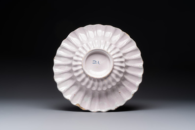 A polychrome Dutch Delft 'Queen Mary' dish inscribed 'K M', 17th C.