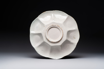 A rare polychrome Dutch Delft 'wildman' dish, 17th C.