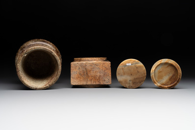 A varied collection of nine Chinese archaistic jade and stone carvings, 20th C.