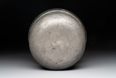 A tinned copper 'kashkul' or begging bowl, a calligraphic bowl and a brass covered jar, Iran, 18/19th C.