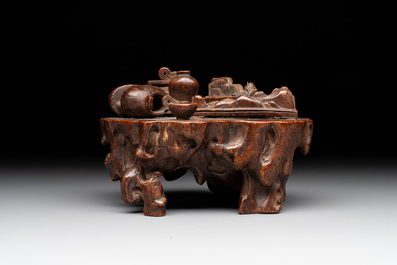 A Chinese agarwood carving of a miniature table with antiquities, 18/19th C.