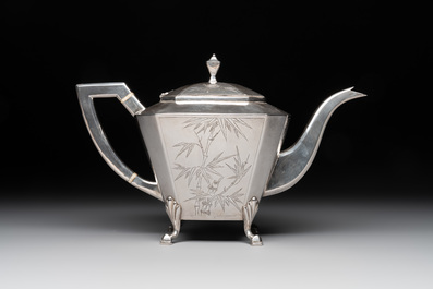A Chinese silver covered teapot, sugar jar and milk jug with bamboo design, Tackhing 90% silver mark, 20th C.
