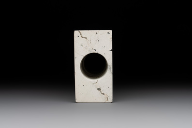 A varied collection of nine Chinese archaistic jade and stone carvings, 20th C.