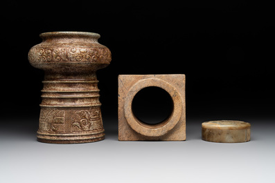 A varied collection of nine Chinese archaistic jade and stone carvings, 20th C.