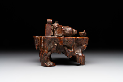 A Chinese agarwood carving of a miniature table with antiquities, 18/19th C.