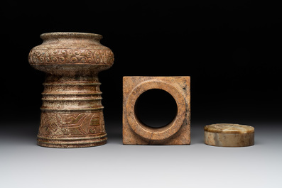 A varied collection of nine Chinese archaistic jade and stone carvings, 20th C.