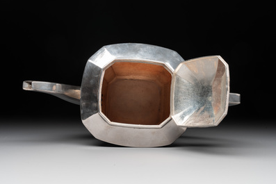 A Chinese silver covered teapot, sugar jar and milk jug with bamboo design, Tackhing 90% silver mark, 20th C.