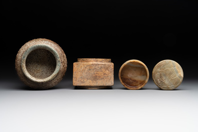 A varied collection of nine Chinese archaistic jade and stone carvings, 20th C.
