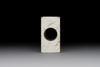 A varied collection of nine Chinese archaistic jade and stone carvings, 20th C.