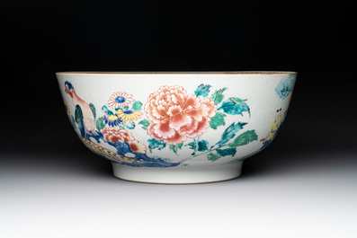 A fine Chinese famille rose bowl with figures, flowers and pheasants, Yongzheng/Qianlong