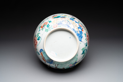 A fine Chinese famille rose bowl with figures, flowers and pheasants, Yongzheng/Qianlong