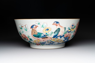 A fine Chinese famille rose bowl with figures, flowers and pheasants, Yongzheng/Qianlong