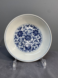 A pair of imperial Chinese blue and white 'lotus scroll' plates, Qianlong mark and of the period