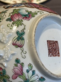 A pair of Chinese Canton famille rose two-handled bowls and covers with narrative design, Daoguang mark and of the period