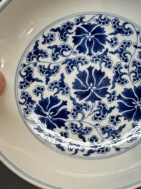 A pair of imperial Chinese blue and white 'lotus scroll' plates, Qianlong mark and of the period