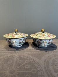 A pair of Chinese Canton famille rose two-handled bowls and covers with narrative design, Daoguang mark and of the period