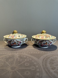 A pair of Chinese Canton famille rose two-handled bowls and covers with narrative design, Daoguang mark and of the period