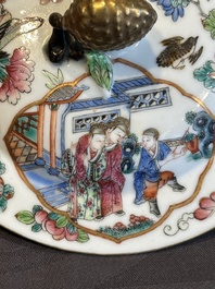 A pair of Chinese Canton famille rose two-handled bowls and covers with narrative design, Daoguang mark and of the period