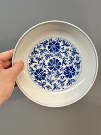 A pair of imperial Chinese blue and white 'lotus scroll' plates, Qianlong mark and of the period