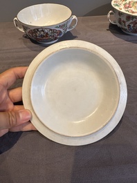 A pair of Chinese Canton famille rose two-handled bowls and covers with narrative design, Daoguang mark and of the period