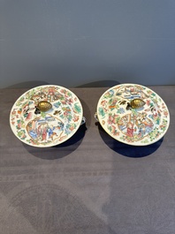 A pair of Chinese Canton famille rose two-handled bowls and covers with narrative design, Daoguang mark and of the period