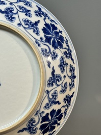 A pair of imperial Chinese blue and white 'lotus scroll' plates, Qianlong mark and of the period