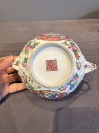 A pair of Chinese Canton famille rose two-handled bowls and covers with narrative design, Daoguang mark and of the period