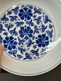 A pair of imperial Chinese blue and white 'lotus scroll' plates, Qianlong mark and of the period