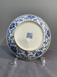 A pair of imperial Chinese blue and white 'lotus scroll' plates, Qianlong mark and of the period