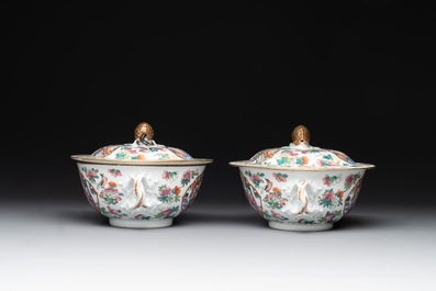 A pair of Chinese Canton famille rose two-handled bowls and covers with narrative design, Daoguang mark and of the period