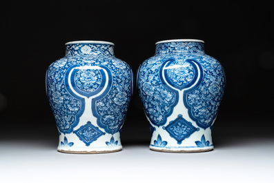 A pair of Chinese blue and white 'peony scroll' vases, Kangxi