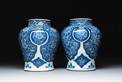 A pair of Chinese blue and white 'peony scroll' vases, Kangxi