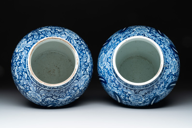 A pair of Chinese blue and white 'peony scroll' vases, Kangxi