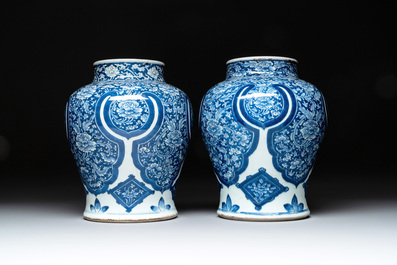 A pair of Chinese blue and white 'peony scroll' vases, Kangxi