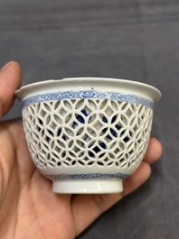 A Chinese blue and white reticulated double-walled cup and saucer, fu mark, Kangxi