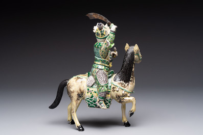 A fine Chinese verte biscuit sculpture of a Heavenly King on horseback, 19th C.