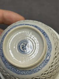 A Chinese blue and white reticulated double-walled cup and saucer, fu mark, Kangxi