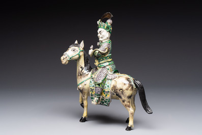 A fine Chinese verte biscuit sculpture of a Heavenly King on horseback, 19th C.