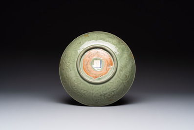 A Chinese Longquan celadon dish with floral design, Ming