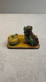 A pair of Chinese sancai-glazed Buddhist lions and an inkwell, 19th C.