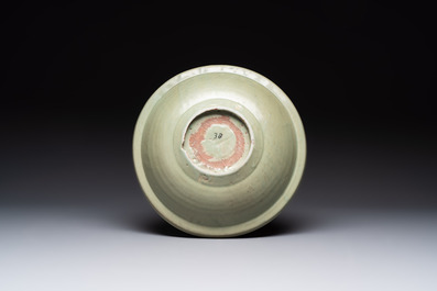 A Chinese Longquan celadon plate with floral design, Yuan/Ming