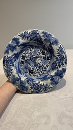 A Chinese blue and white 'phoenix and monkeys' dish and a pair of powder-blue-ground plates, Kangxi/Yongzheng