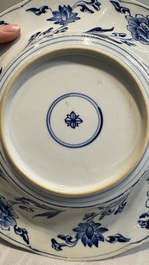 A Chinese blue and white 'phoenix and monkeys' dish and a pair of powder-blue-ground plates, Kangxi/Yongzheng