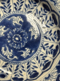 A Chinese blue and white reticulated double-walled cup and saucer, fu mark, Kangxi